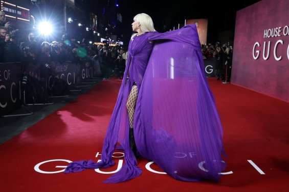 Lady Gaga strikes in a purple dress by Gucci at the premiere of House of Gucci