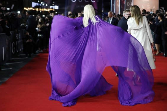 Lady Gaga strikes in a purple dress by Gucci at the premiere of House of Gucci