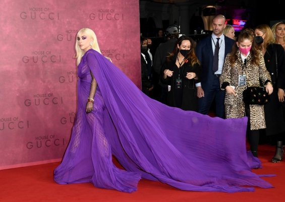 Lady Gaga strikes in a purple dress by Gucci at the premiere of House of Gucci