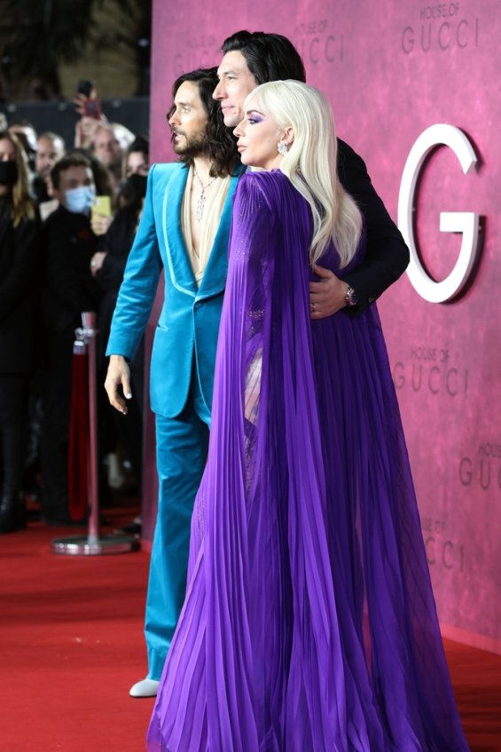 Lady Gaga strikes in a purple dress by Gucci at the premiere of House of Gucci