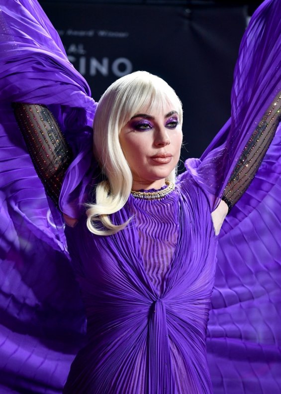 Lady Gaga strikes in a purple dress by Gucci at the premiere of House of Gucci