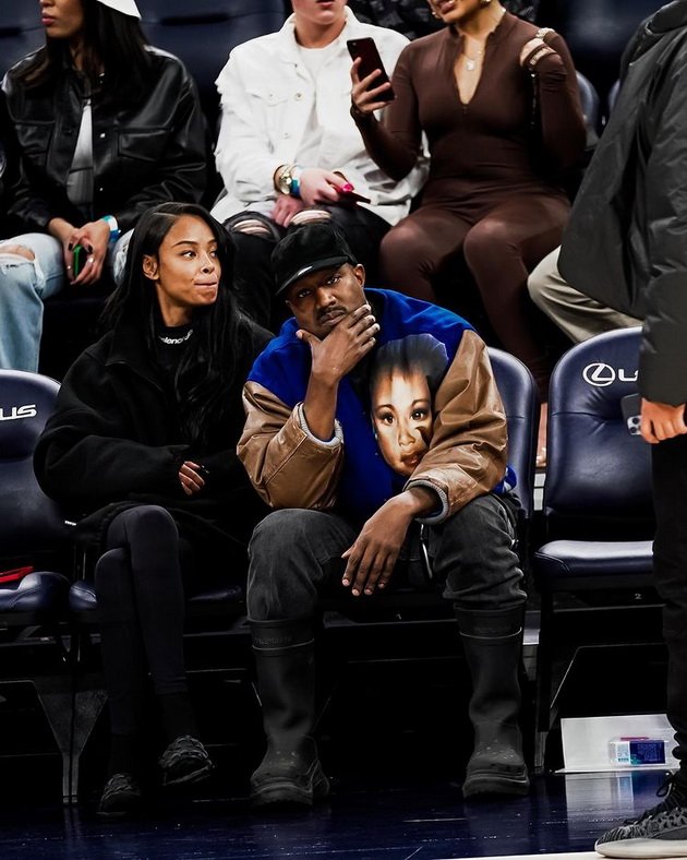 Kanye West and a new 22-year-old girl were photographed at a basketball game