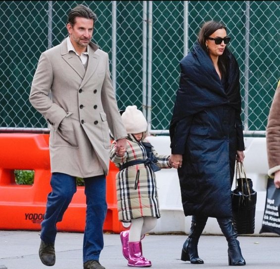 PHOTO: Irina Shayk and Bradley Cooper smiling arm in arm with daughter Lea in New York