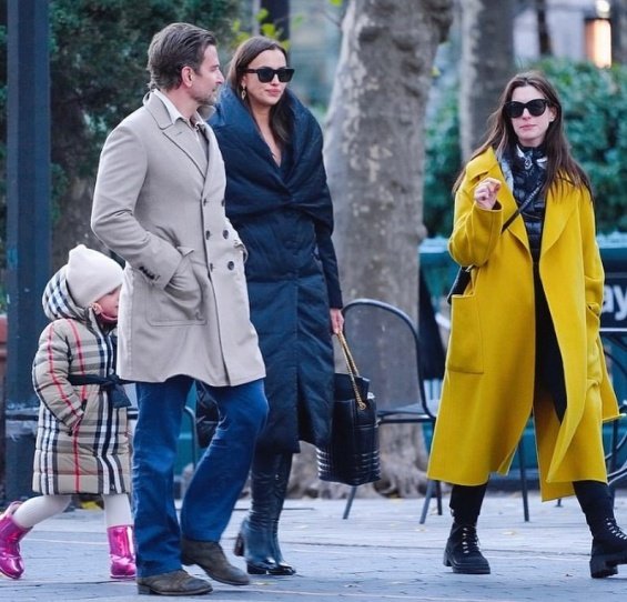 PHOTO: Irina Shayk and Bradley Cooper smiling arm in arm with daughter Lea in New York