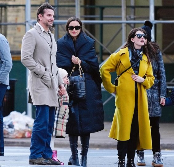 PHOTO: Irina Shayk and Bradley Cooper smiling arm in arm with daughter Lea in New York