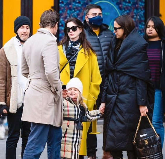 PHOTO: Irina Shayk and Bradley Cooper smiling arm in arm with daughter Lea in New York