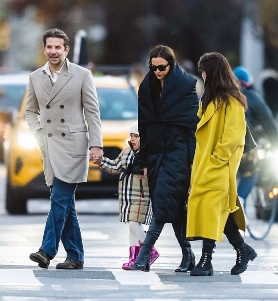 PHOTO: Irina Shayk and Bradley Cooper smiling arm in arm with daughter Lea in New York