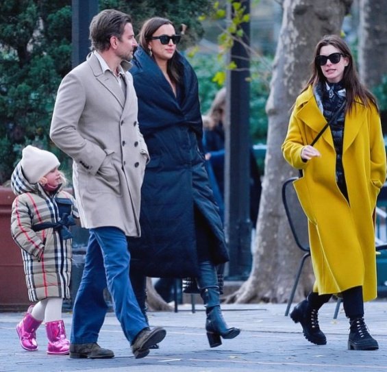 PHOTO: Irina Shayk and Bradley Cooper smiling arm in arm with daughter Lea in New York