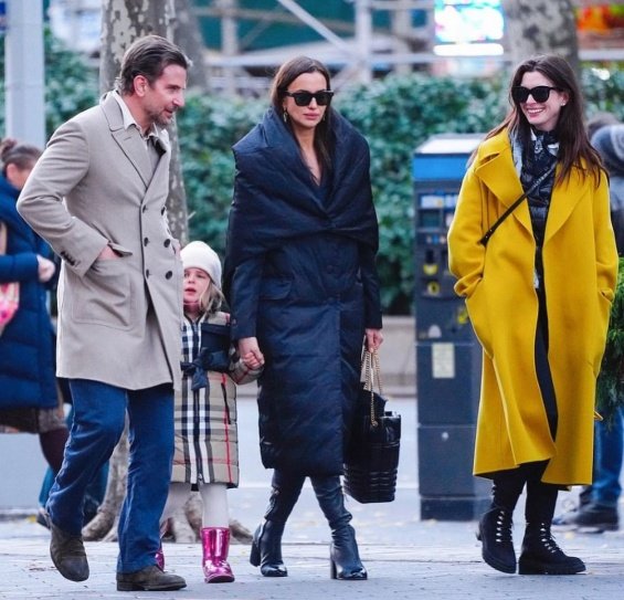 PHOTO: Irina Shayk and Bradley Cooper smiling arm in arm with daughter Lea in New York