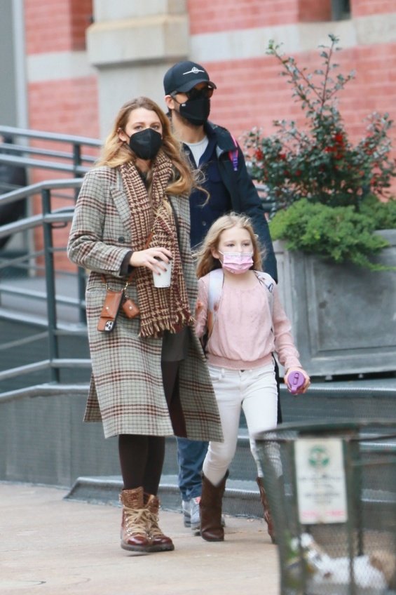 Blake Lively and Ryan Reynolds photographed on a walk with their eldest daughter