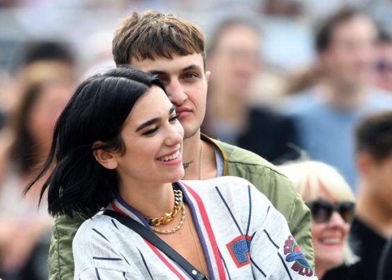 Dua Lipa relaxes on the beach in a neon bikini after breaking up with Anwar Hadid