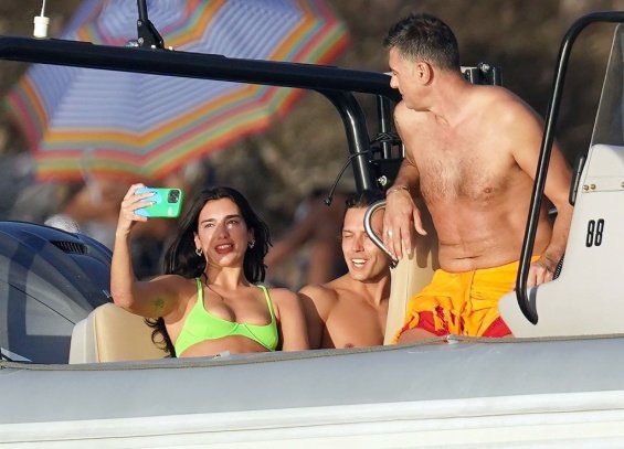 Dua Lipa relaxes on the beach in a neon bikini after breaking up with Anwar Hadid
