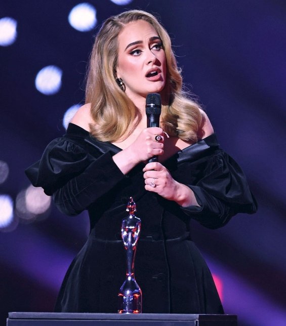 Adele at the Brit Awards with a glittering ring sparked rumors that she was engaged