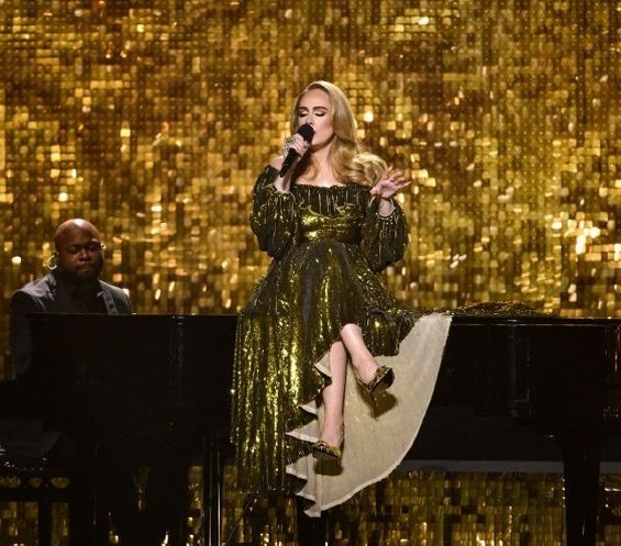 Adele at the Brit Awards with a glittering ring sparked rumors that she was engaged