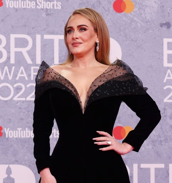 Adele at the Brit Awards with a glittering ring sparked rumors that she was engaged