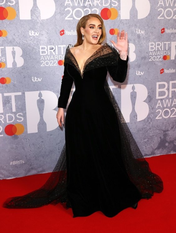 Adele at the Brit Awards with a glittering ring sparked rumors that she was engaged