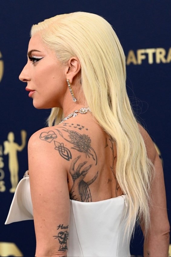 Lady Gaga in a glamorous Armani dress met Bradley Cooper at the SAG Awards