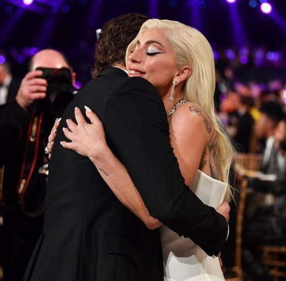 Lady Gaga in a glamorous Armani dress met Bradley Cooper at the SAG Awards