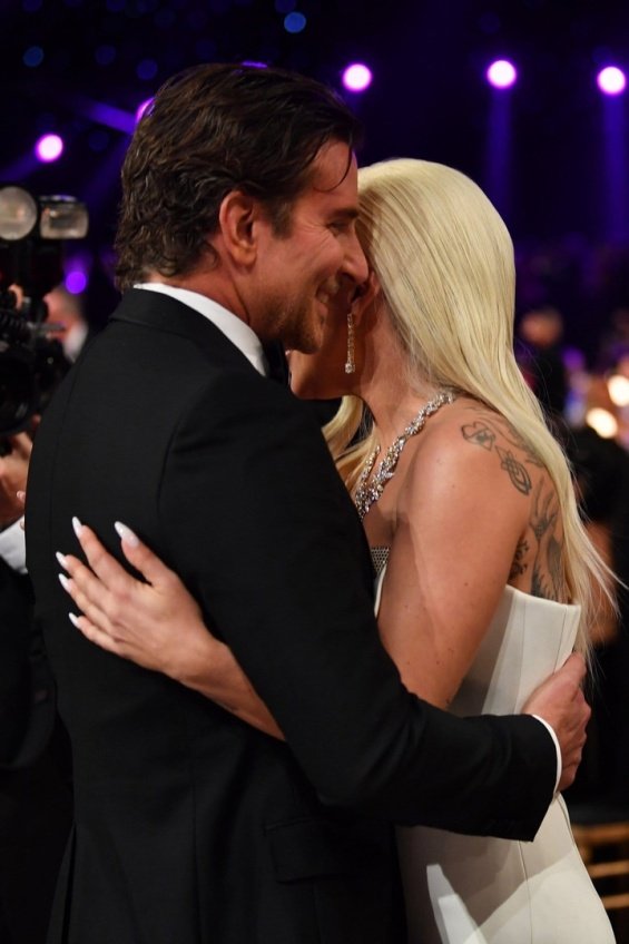 Lady Gaga in a glamorous Armani dress met Bradley Cooper at the SAG Awards