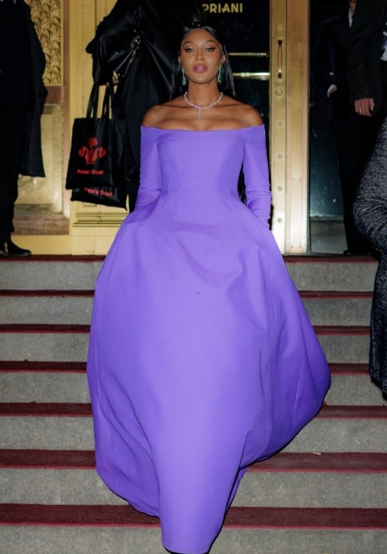 Naomi Campbell as a princess in a purple ball gown photographed at a gala
