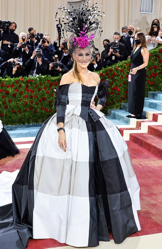 Sarah Jessica Parker in a black and white dress and a striking fashion accessory at the Met Gala 2022