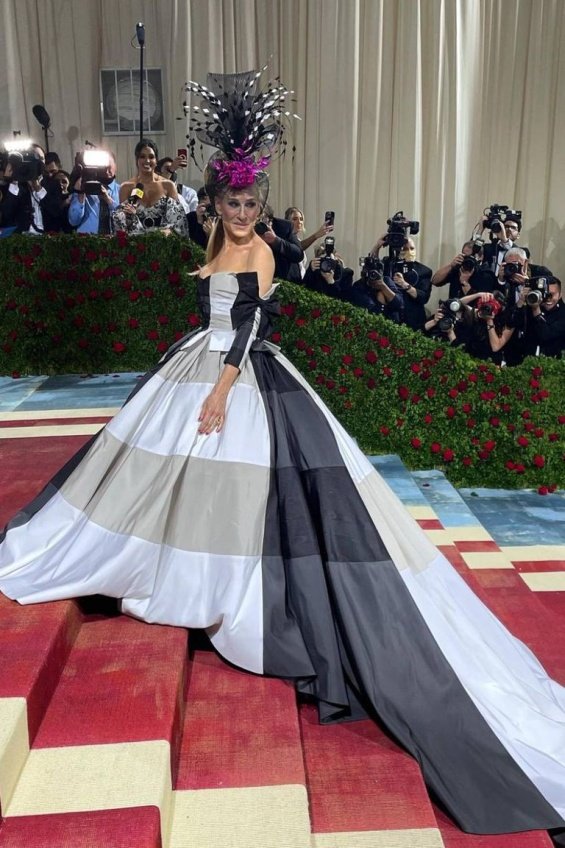 Sarah Jessica Parker in a black and white dress and a striking fashion accessory at the Met Gala 2022