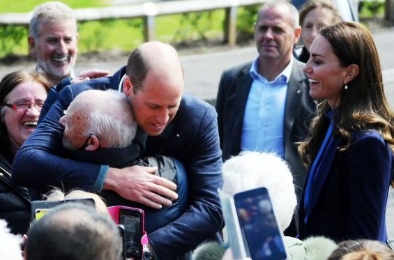 Prince William hugs an older man overwhelmed by emotions on a tour with Catherine in Scotland