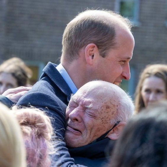 Prince William hugs an older man overwhelmed by emotions on a tour with Catherine in Scotland