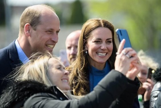 Prince William hugs an older man overwhelmed by emotions on a tour with Catherine in Scotland