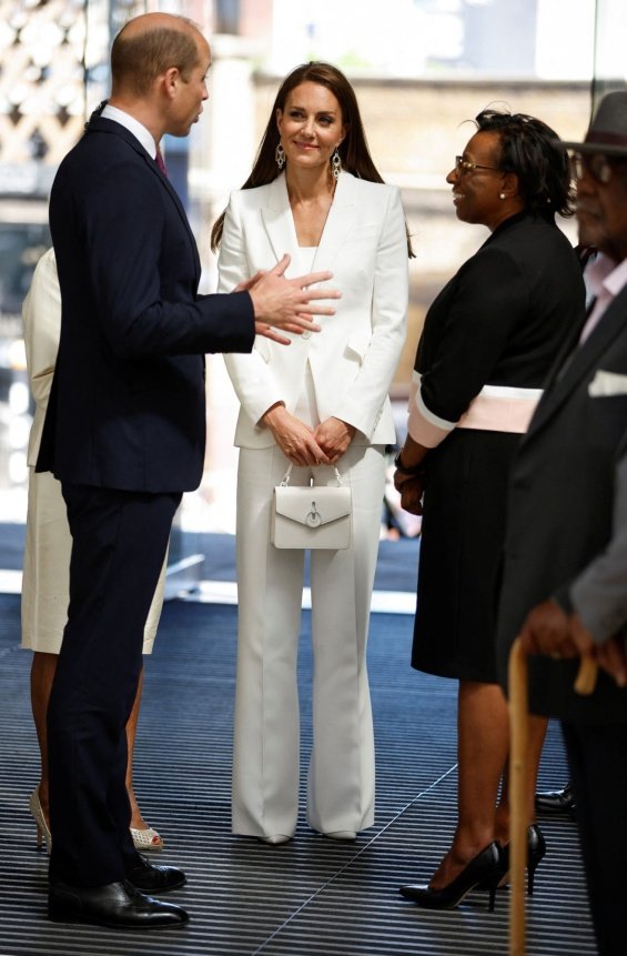 Duchess Catherine in an elegant suite at an event with Prince William
