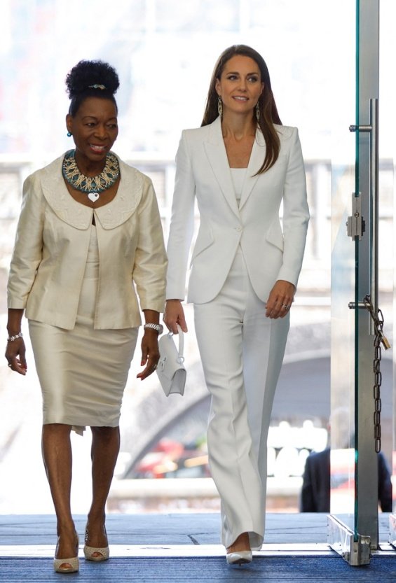 Duchess Catherine in an elegant suite at an event with Prince William