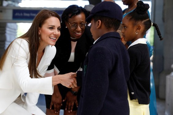 Duchess Catherine in an elegant suite at an event with Prince William