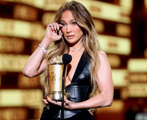 Jennifer Lopez in a black outfit with a deep neckline received an award at the MTV Movie & TV Awards