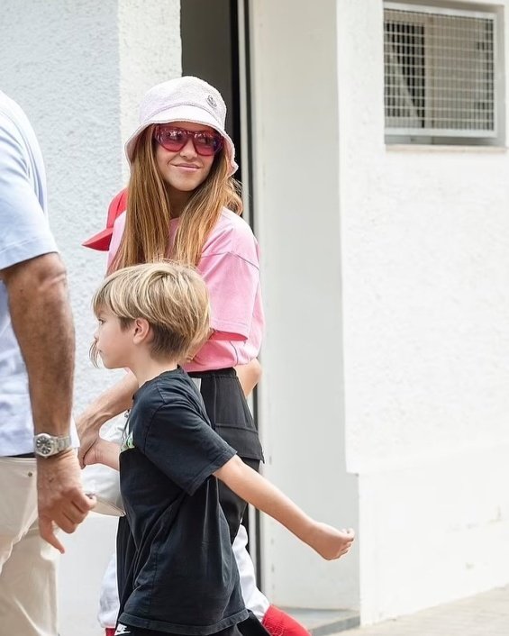 Shakira with her sons at a baseball game in Valencia