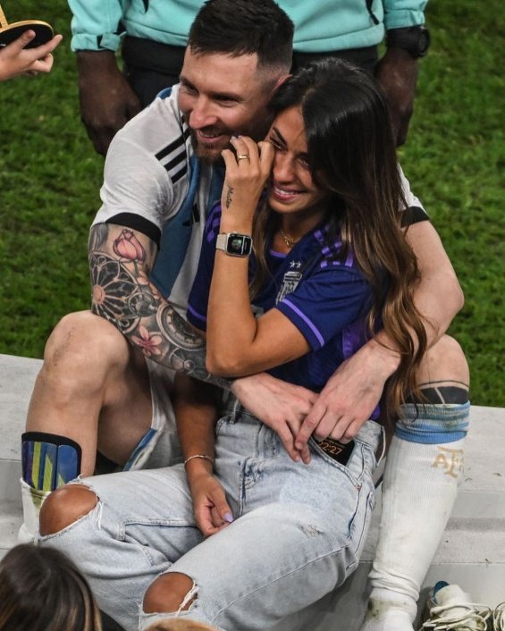 Lionel Messi in the arms of his wife and three sons celebrated for winning the World Cup