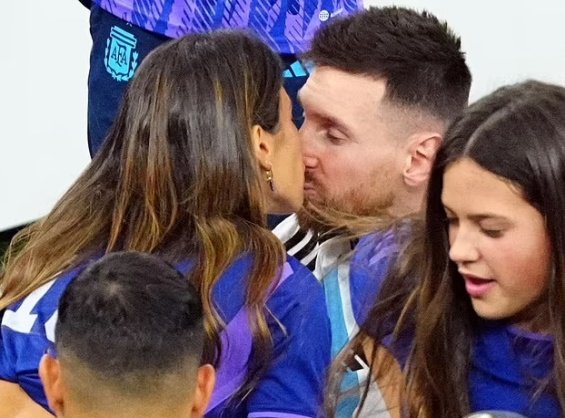 Lionel Messi in the arms of his wife and three sons celebrated for winning the World Cup