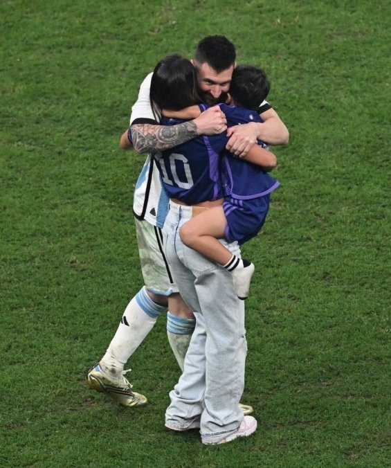 Lionel Messi in the arms of his wife and three sons celebrated for winning the World Cup