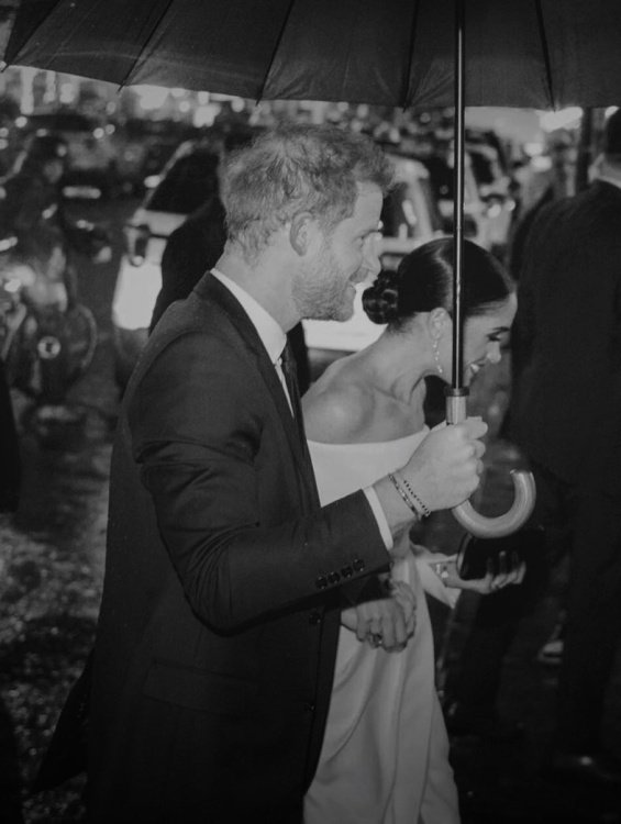 Meghan Markle next to Prince Harry at an event where they received an award