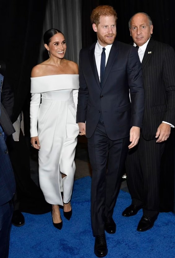 Meghan Markle next to Prince Harry at an event where they received an award