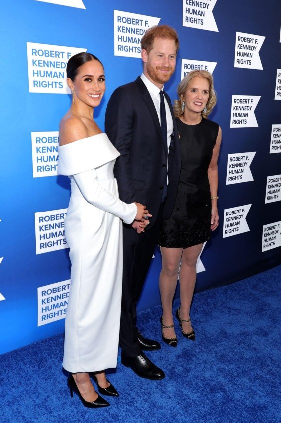 Meghan Markle next to Prince Harry at an event where they received an award