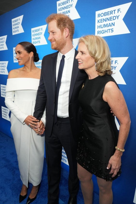 Meghan Markle next to Prince Harry at an event where they received an award