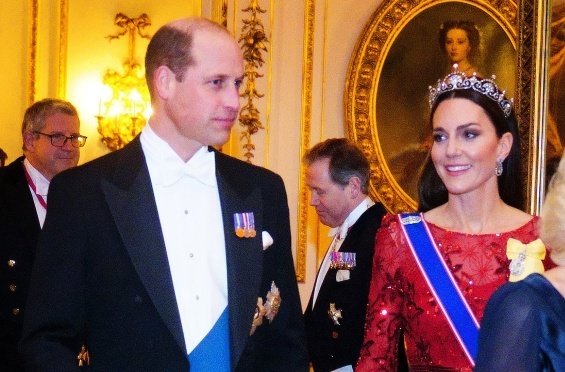 Princess Catherine dressed up in a red creation and tiara at a reception at Buckingham Palace