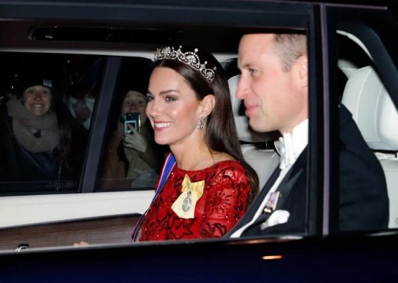 Princess Catherine dressed up in a red creation and tiara at a reception at Buckingham Palace