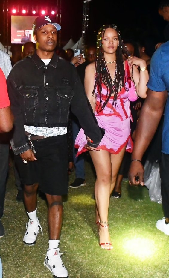 Rihanna in a miniskirt in the arms of ASAP Rocky at a music festival in Barbados