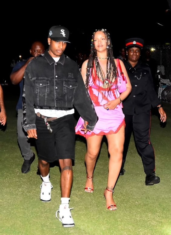 Rihanna in a miniskirt in the arms of ASAP Rocky at a music festival in Barbados