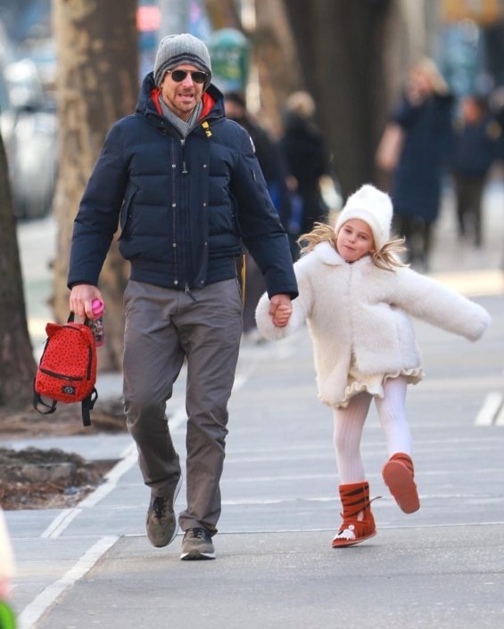 Bradley Cooper holding hands with his daughter photographed on a walk