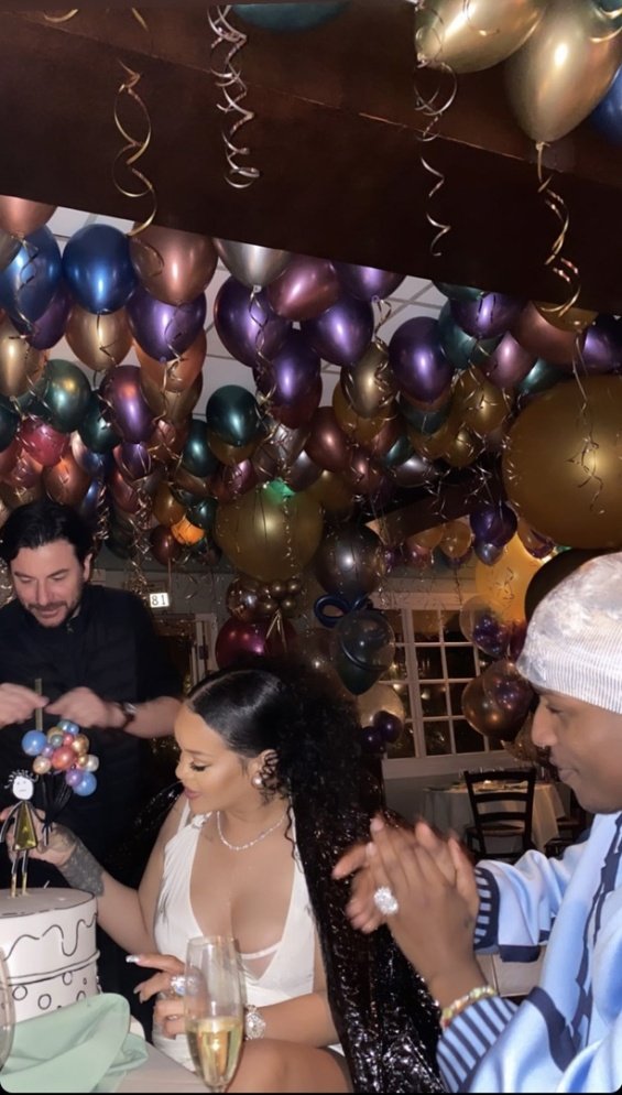 Pregnant Rihanna in a mini dress at a birthday dinner with ASAP Rocky