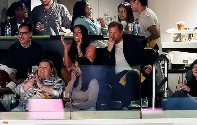 Meghan Markle and Harry relaxed and in love at a basketball game, while Kate Middleton performs Royal duties