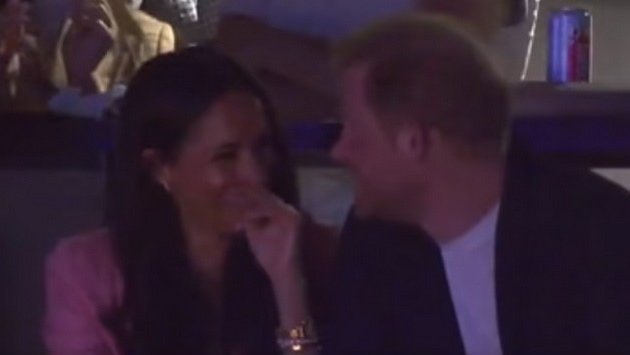 Meghan Markle and Harry relaxed and in love at a basketball game, while Kate Middleton performs Royal duties