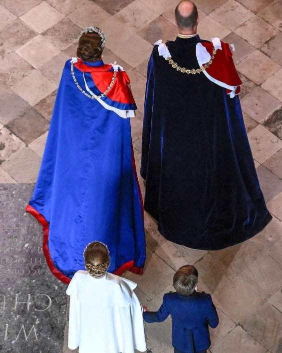 Princess Charlotte with a flower wreath as Princess Catherine holding hands with brother Louis at the coronation